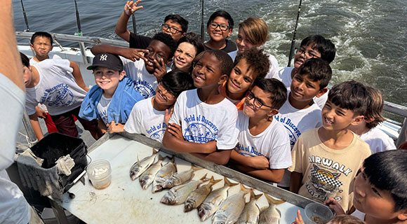 First Day at World of Discovery Day Camp can include a fishing trip.